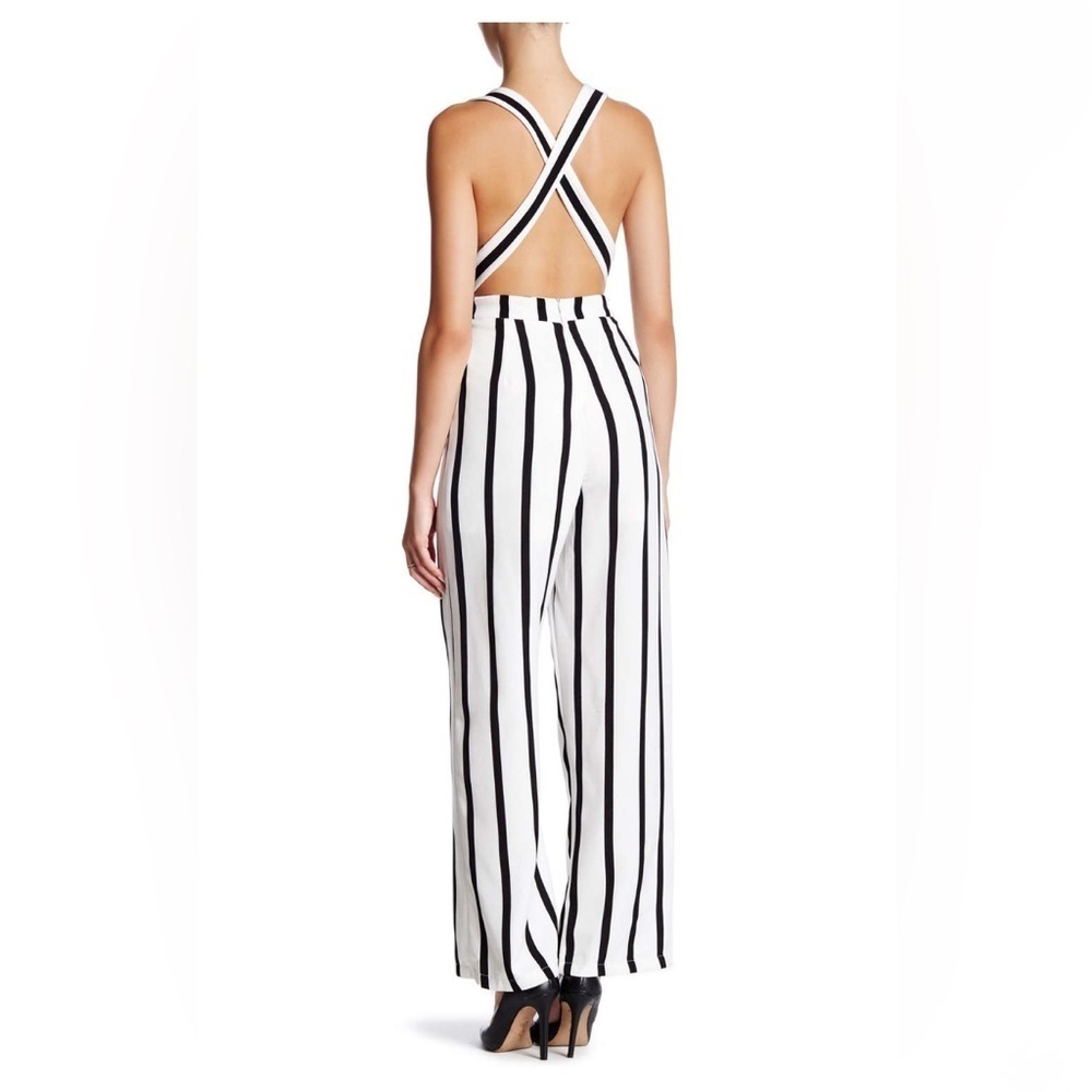 Black and white striped jumpsuit with a deep plunge - Picture 3 of 4